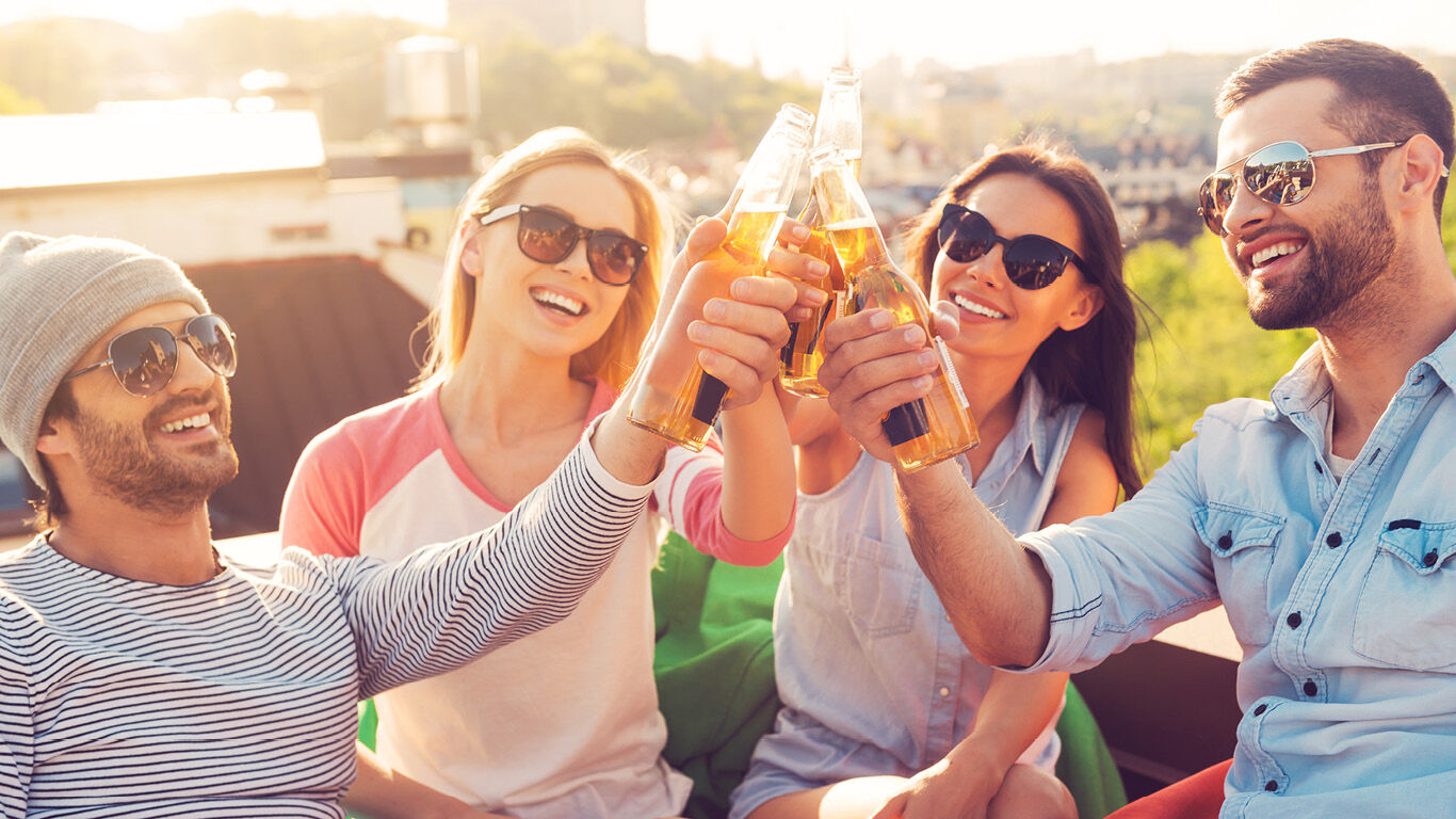 People enjoying alcohol together under the sun