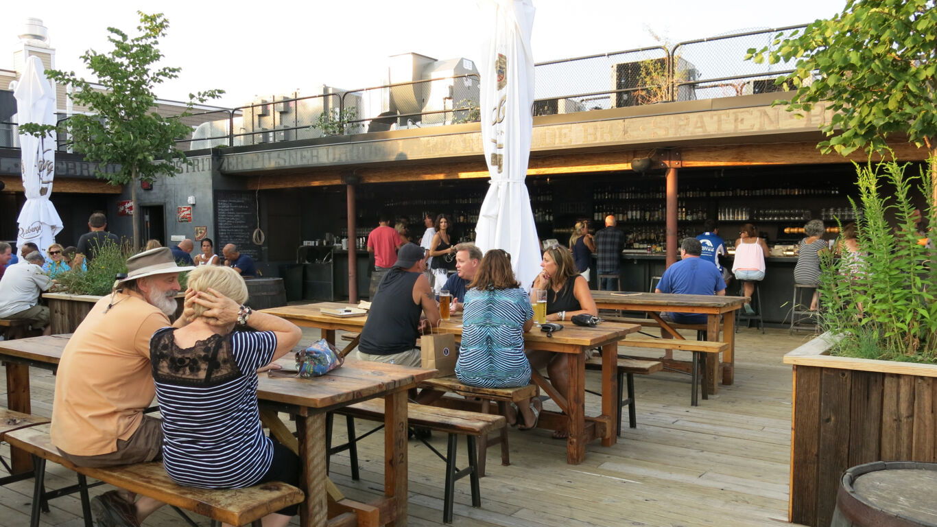 Customers enjoying drinks at Asbury Biergarten